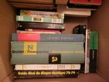 a box full of books that are stacked on top of each other