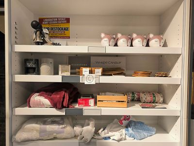 many items on the shelves in the cabinet