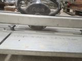 a picture of a table saw in a warehouse