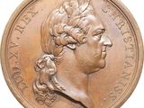 an image of a close up of a coin with a woman ' s face