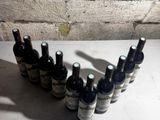 bottles of wine lined up in a row on a table