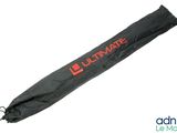 the umbrella is black and has a red logo on it