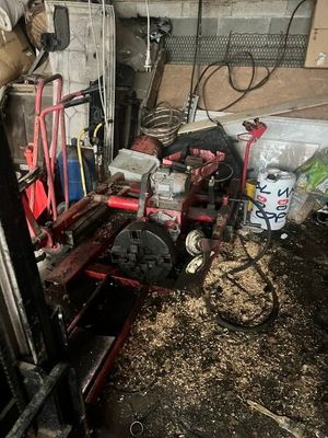 an image of a man working on a machine in a garage