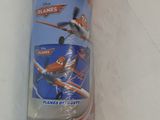 a roll of blue fabric with planes on it