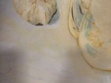 a painting of a teapot and garlic on a table