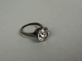 an image of a diamond ring on a white surface