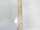 a close up of a metal object on a white surface