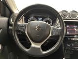 the interior of a car with a steering wheel and dashboard controls