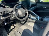 the interior of a car with the door open showing the steering wheel and dashboard