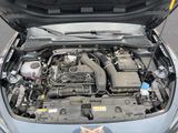 the engine of a car with its hood open and the hood up