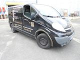 a black van that is parked in a parking lot