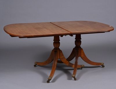 an oval dining table with two leaves on the top