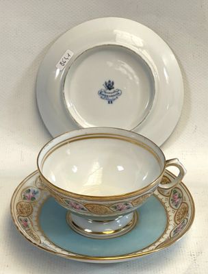 a tea cup and saucer sitting on a table