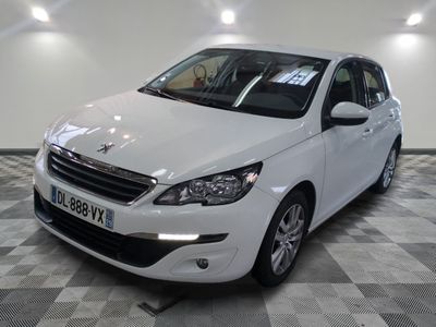 a white car that is parked on a checkered floor