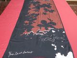 a long table with a red table cloth on it