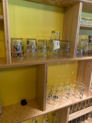 many glasses on the shelves in the room