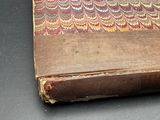 an old book that is sitting on a table