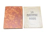 two books sitting next to each other on a white surface