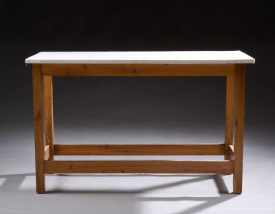 a small table with a white marble top and wooden legs