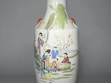 a white vase with a painting on the side of it