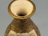 a vase that has a picture of people on it