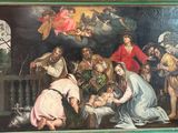un tableau représentant une crèche avec un bébé dans une mangeoire