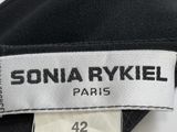 the label of a black jacket with a white and black label