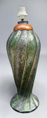 a green vase with a brown lid on a white background