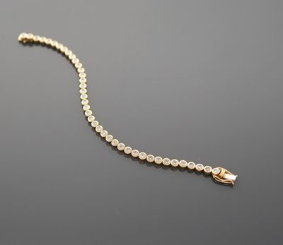 Bracelet tennis en or jaune 18K 750 millièmes orné de 37 dia…