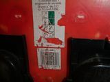 a red fire hydrant that has a sticker on it