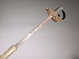 someone is holding a hammer with a wooden handle in their hand