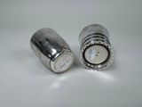 pair of silver salt and pepper shakers on a white surface