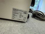 a label on the back of a machine that is sitting on the floor