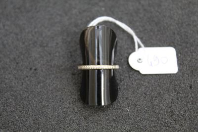 a ring that is sitting on top of a black object