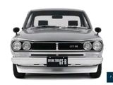 a silver car that is parked in front of a white background