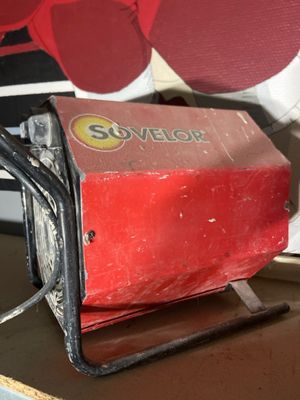 a red machine that is sitting on top of a table