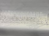 a lot of empty wine glasses sitting on a table