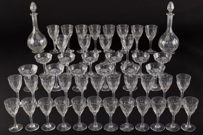 an assortment of wine glasses and decanters on a black background