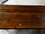 a wooden table with a small white dot on it