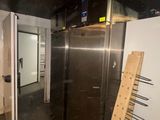an image of a large stainless steel refrigerator in a room