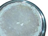a glass jar with a lid on a white background