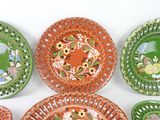 a lot of plates that are on the wall