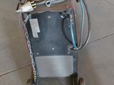 a machine that is sitting on the floor in the garage