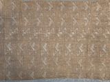 an old piece of cloth with a design on it