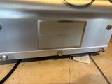 an image of a stainless steel oven sitting on top of a tiled floor