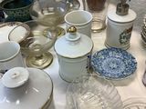 a table with a lot of dishes and cups on it
