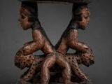 an image of a wooden table with two figures on it