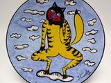 a plate with a painting of a cat on it