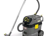 a grey and yellow vacuum cleanerer sitting on top of a white surface