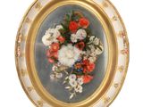 une photo représentant un tableau de fleurs dans un cadre doré